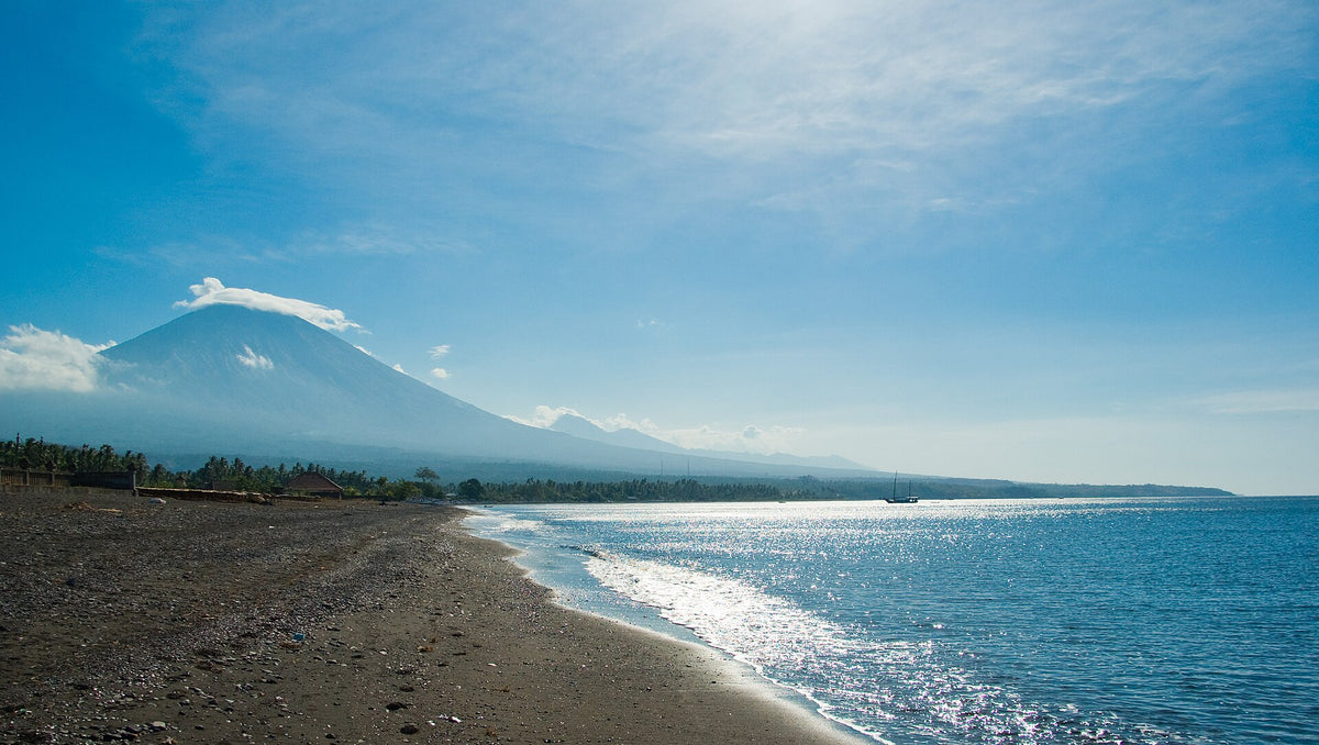 Mount Agung beyond the beach at Amed, Bali