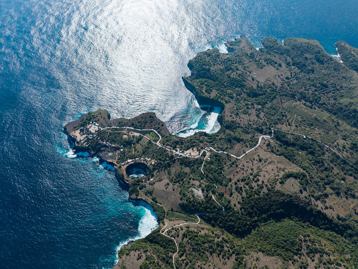 Aerial view of the natural arch and cove at Broken Beach, Nusa Penida