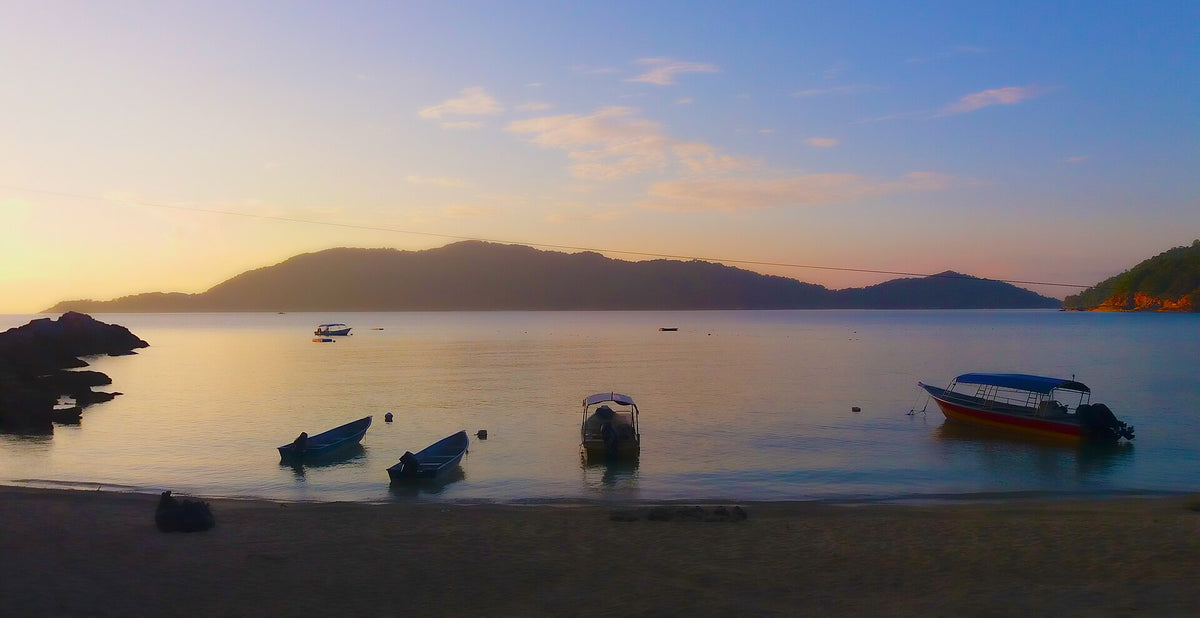 Small boats at dawn in the Perhentian Islands