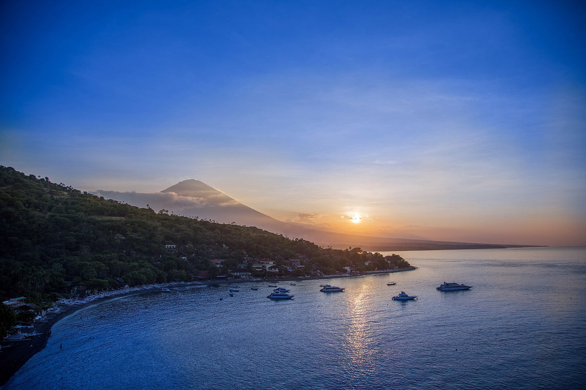 Golden light over Amed bay and Mount Agung, Bali