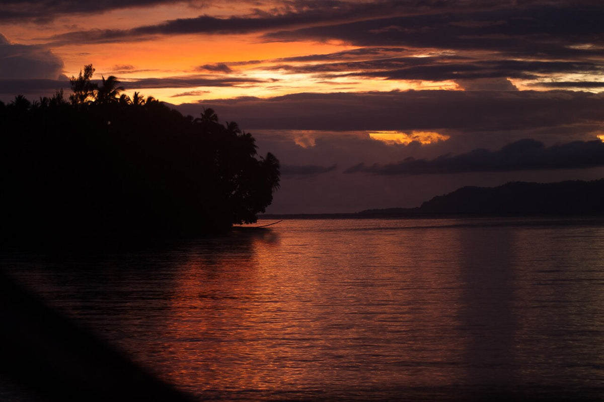 Sunset over a cove on the western end of Gizo Island, Solomon Islands