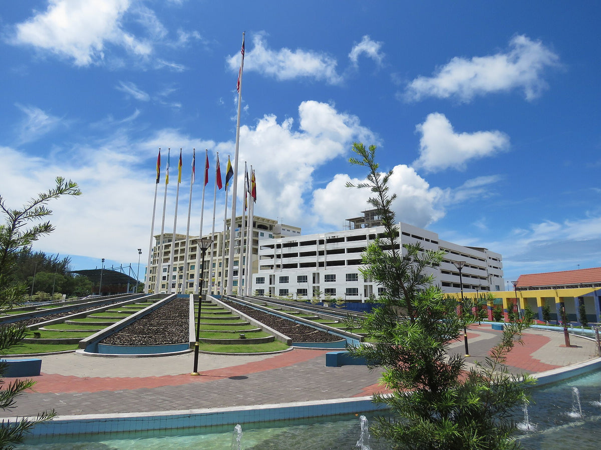 Flags and waterfront buildings at Labuan Square, Malaysia