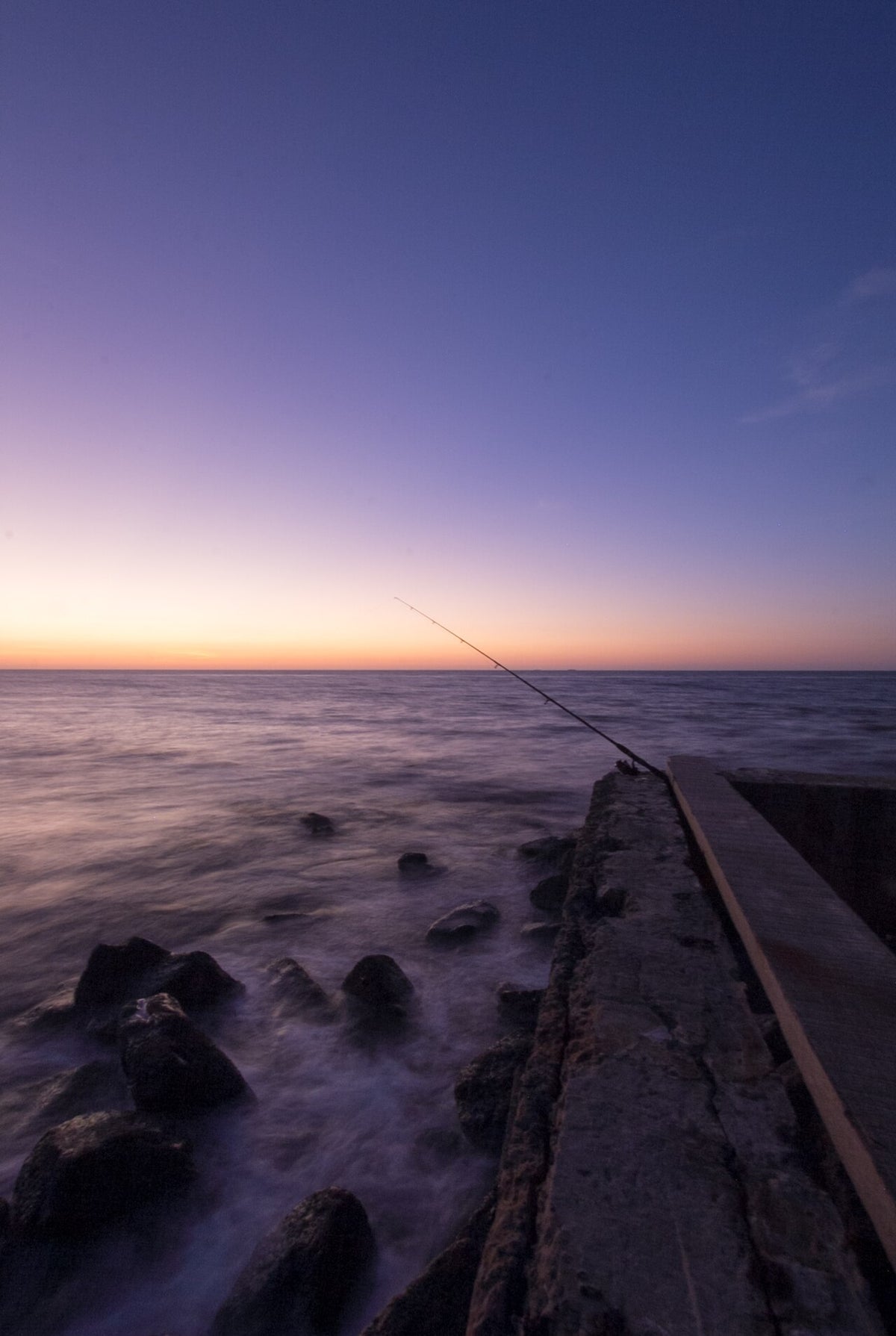 Fishing and sunset on the coast at Tanjung Lobang, Miri