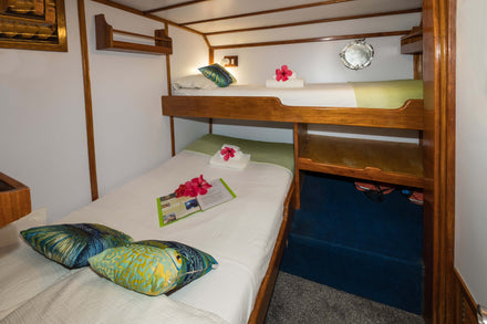 Lower double bed and upper bunk in twin cabin 3 aboard MV FeBrina. Photo: Peter Lange.