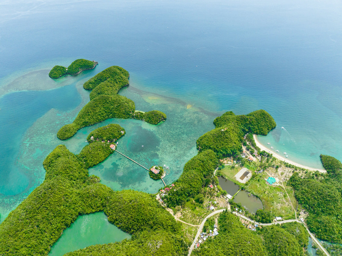 Aerial view of green islets and turquoise bays near Sipalay, Negros, Philippines